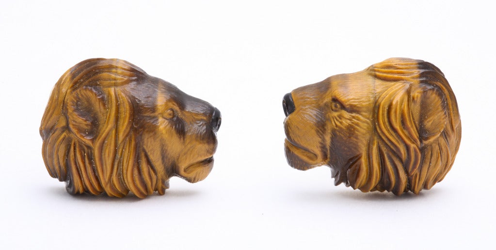 Beautifully carved in rich brown and yellow tiger's eye, this elegant lion comes to life on the cuff.  The fine details of the carving are further accentuated by the changing tones in the material.  The expert carving is done in Germany and the