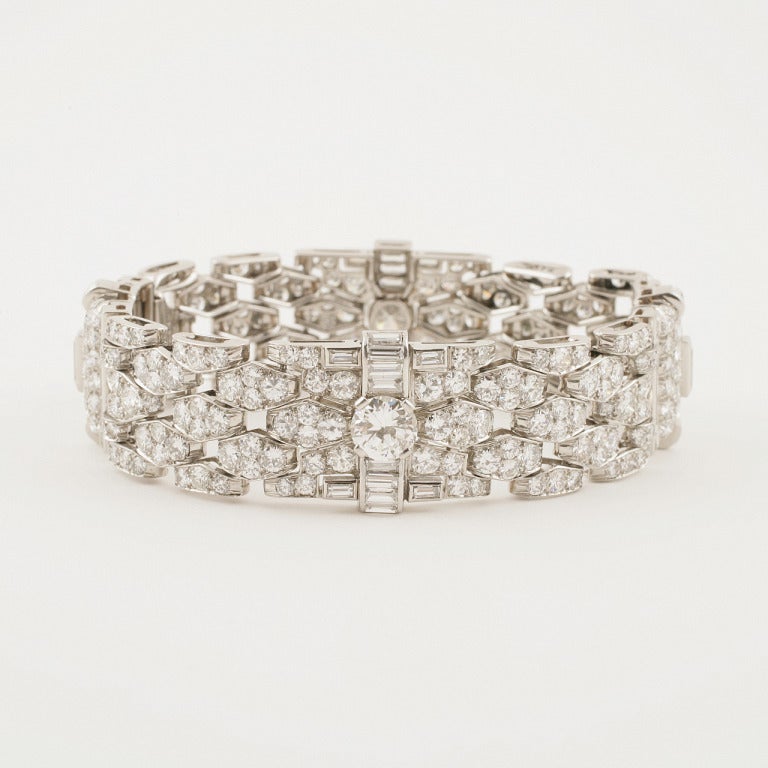 A French Art Deco platinum bracelet with diamonds by Bulgari. The bracelet has 294 round-cut diamonds with an approximate total weight of 16.00 carats, 45 baguette diamonds with an approximate total weight of 6.00 carats,  2 round-cut diamonds with