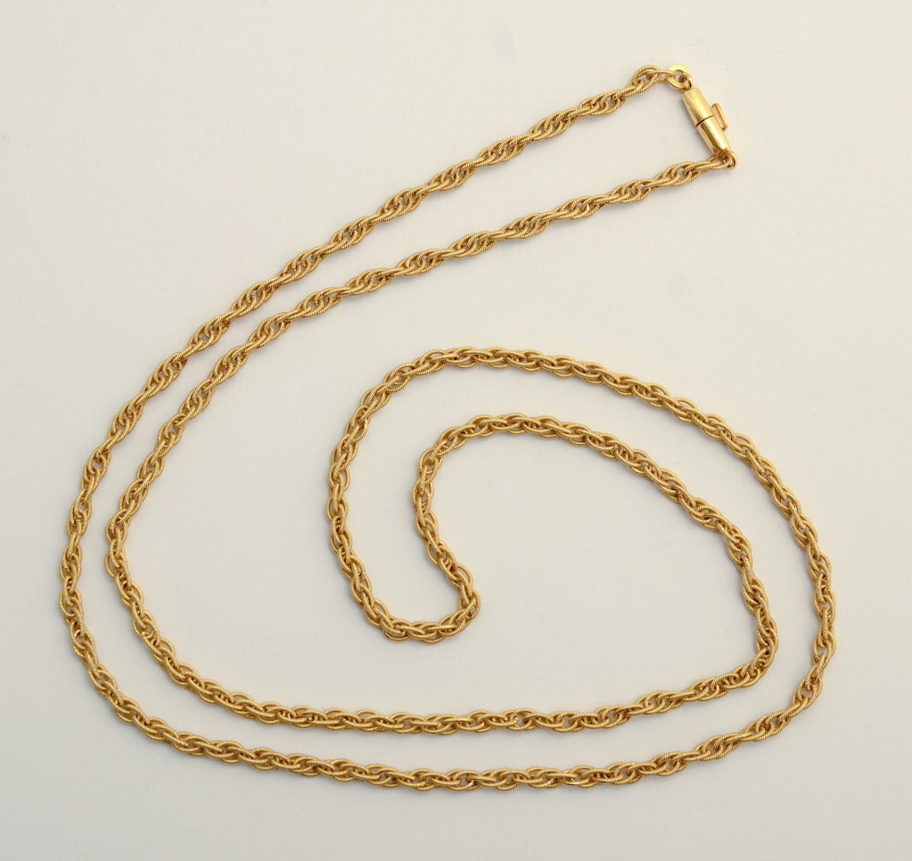 Finely handmade gold chain of intertwined oval links. The necklace measures 34 1/2