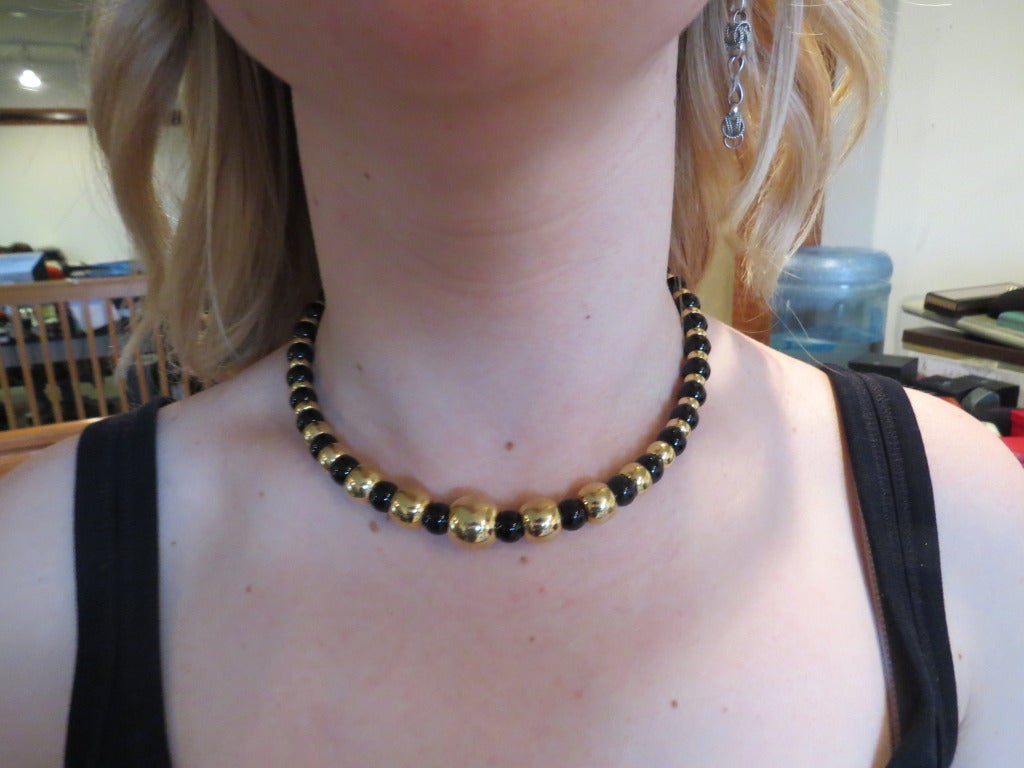 1980s Marina B necklace from Sfera collection with 18k yellow gold and onyx graduated beads. Necklace is 16" long, beads range from 9mm to 15.4mm in diameter. Marked - 2419,marina B,750. weight - 81.4g