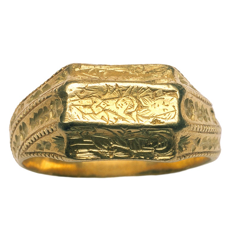 From a large group of rings that are called in the literature “iconographic”, this ring is an especially fine example. The engraved bezel presents a triptych: in the center is the Gnadenstuhl (“Throne of Mercy”) and on the left and right cells