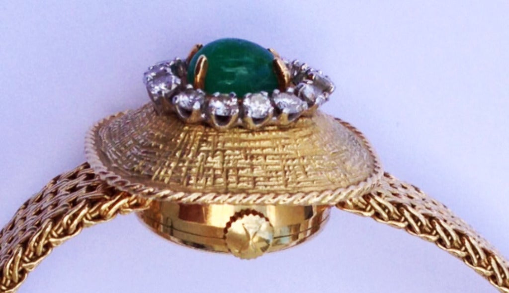 A fine and rare Favre-Leuba lady's 18k yellow gold and diamond-set (approx. .60ctw) bracelet watch with cabochon emerald (approx. .80ct). Swiss mechanical movement circa 1960s.