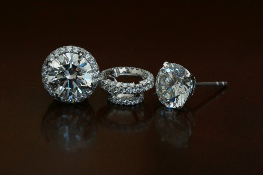 A unique ensemble of diamond stud earrings with precisely matching diamond 