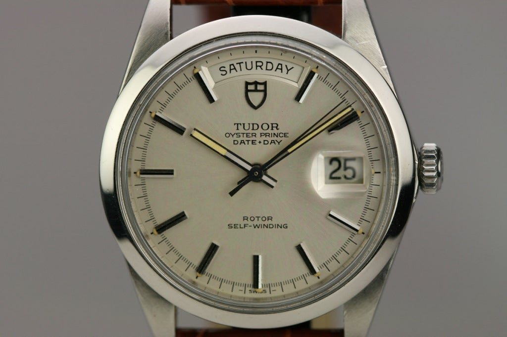Beautiful Tudor Date + Day wristwatch, Ref. 7996/0, with silvered dial and smooth bezel.