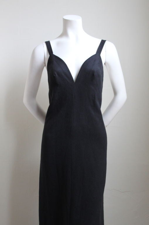 Very rare jet black moleskin gown with low back and contoured bodice from Issey Miyake dating to the 1970's. Dress is labeled a size 8, however it best fits a US 2-4. Zips up center back. Fully lined. Made in Japan. Excellent condition.