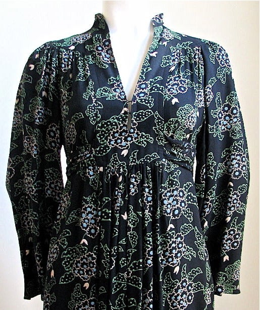 Very rare moss crepe dress with African Violet print designed by Celia Birtwell for Ossie Clark dating to 1972. Dress has a deep neckline, wide kimono sleeves and adjustable long ties at back of empire waist. Colors are black, pink, light blue, and