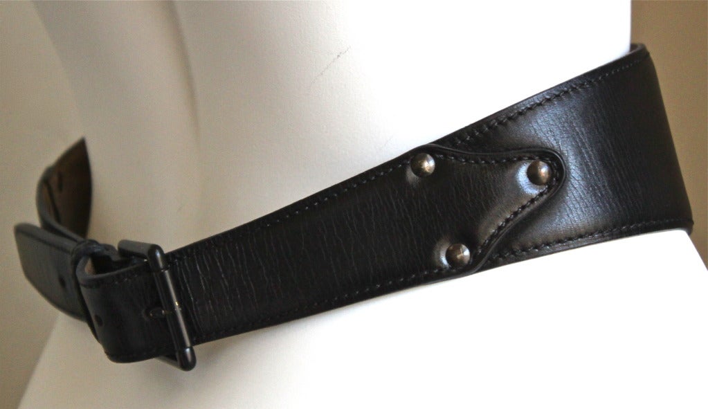 Jet black leather belt with lace up corset detail designed by Azzedine Alaia dating to the early 1990's. Labeled a French size 75. Width of belt is 3.5