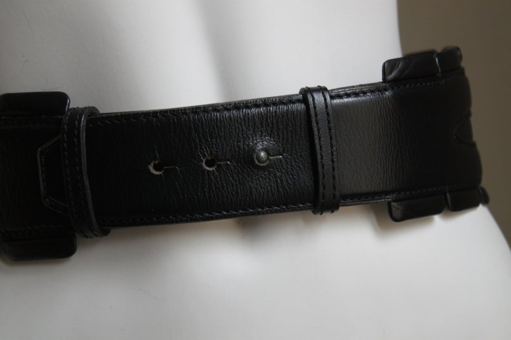 Very rare jet black leather belt with silver toned pyramid studs from Azzedine Alaia dating to the early 1990's. Belt is labeled a French 70 and ideally fits a 25-26.5