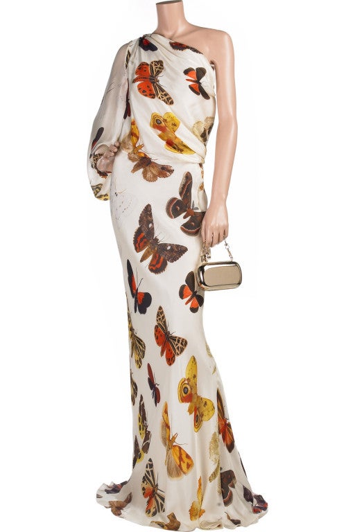 2005 Alexander McQueen One Shoulder Butterfly Print Gown 

This stunning evening gown which requires minimal accessories - a real investment piece.

Ivory long sleeve asymmetrical floor length evening gown. Alexander McQueen gown has a