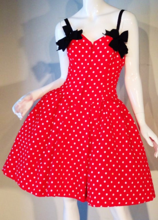 A rare vintage Christian Lacroix haute couture pouf dress. A fantastic sculpted red and white polka dot cotton pique item features multiple layer crinolines, black silk ribbon bows and straps and original matching separate arm puffs (worn with or