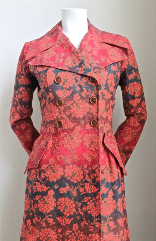 Vivid gradient colored floral coat from Yves Saint Laurent dating to the 1960. Coat is labeled at FR 42 however it is very small and would best fit a size 6 or 8 at largest. Approximate measurements: shoulder at back 14