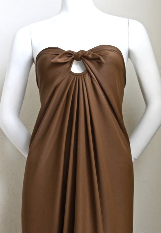 Very rare cocoa brown spiral cut jersey gown designed by Halston dating to 1976. Size label has been removed however this best fits a size 4-8. Unstretched measurements: bust 32