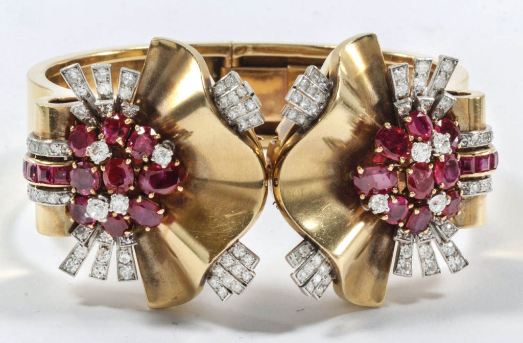 Designed as two detachable retro pins on a hinge bangle set with brilliant- and single-cut diamonds and circular rubies.