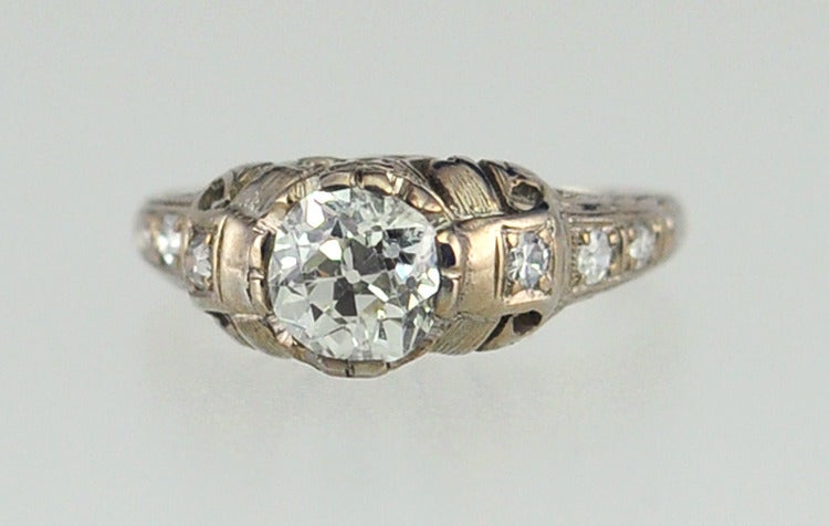 Platinum Art Deco Engagement ring with a 0.91 carat Old European cut diamond H-SI1 (EGL).  6 diamond side stones weighing approximately 0.18 carats.