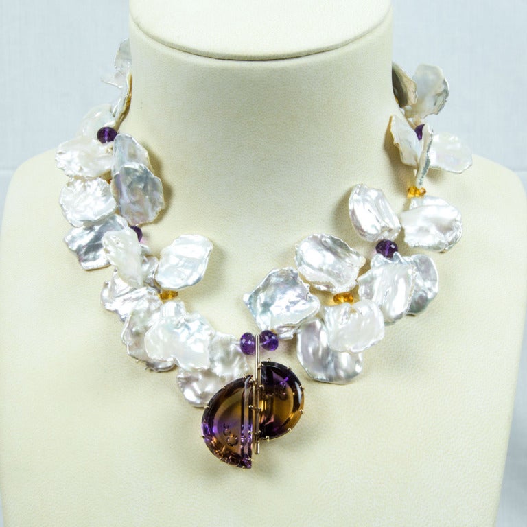 Spectacular Keshi Pearl Necklace interspersed with Natural Amethyst and Citrine Rondelles and suspending an Ametrine Pendant featuring two Demi-Lune Ametrine in handmade 14k white gold mounting. One-of-a-Kind… Fabulous and unique as you are!