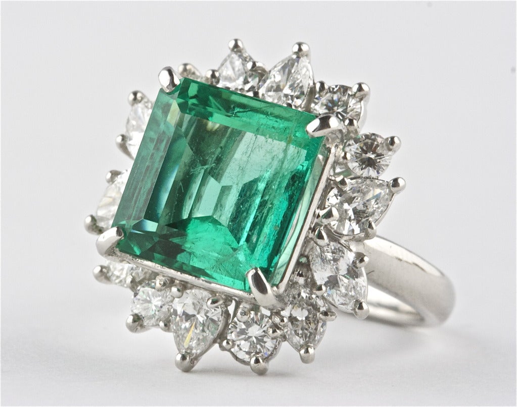 The emerald weighs 6.30 and is GIA certified as Colombian origin. Accented by 2.05 carats of round, pear shape and marquise diamonds. The diamonds are well cut, clean and white.

Ring size 7 and can be re-sized.