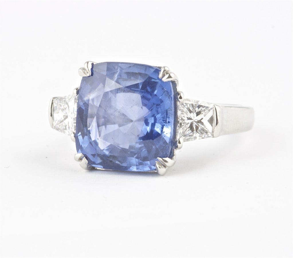 The sapphire is a good shade of blue and is in a well designed platinum ring. The sapphire weighs 7.20 carats and is GIA certified as Ceylon origin with no indications of heating.

Ring size 6 and can be re-sized.