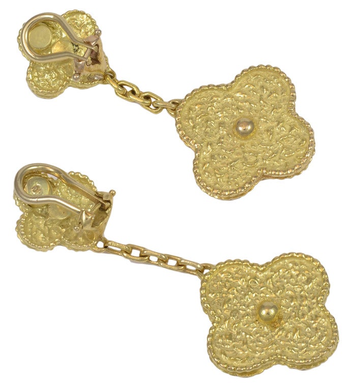 An absolute must have.  Van Cleef & Arpels 18k Gold Vintage Alhambra clip drop earrings. This emblematic and celebrated clover shaped earrings has been a favorite among fans and is made of gorgeous 18k yellow gold and feature the celebrated round