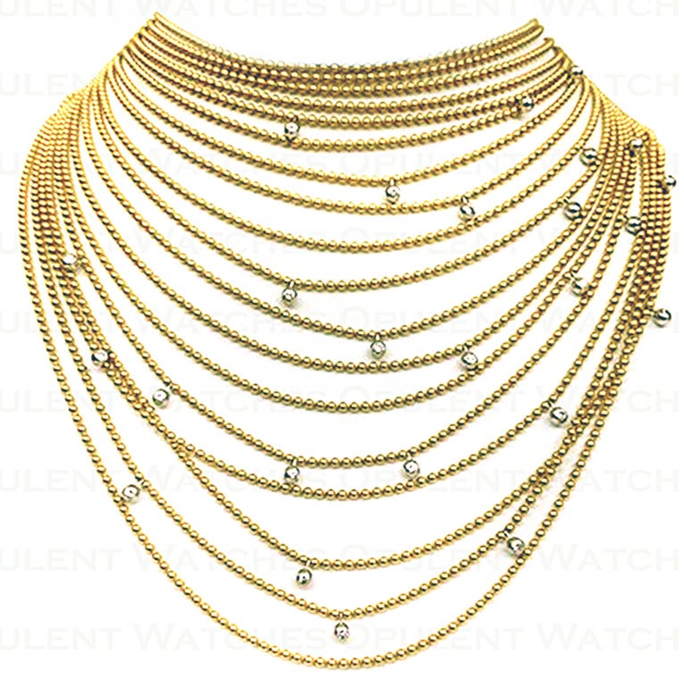 This magnificent necklace features 18 cascading strands of various length necklaces, adorned by 25 VVS1 E Color Round Brilliant Cut Diamonds. The first necklace measures 14 Inches in length, following down to 23 Inches. This necklace is crafted out