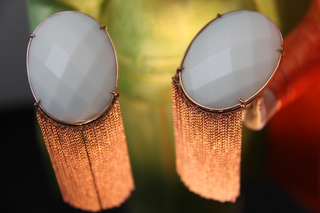 Faceted white quartz with series of intricate rose-gold fringes.

Measures 4