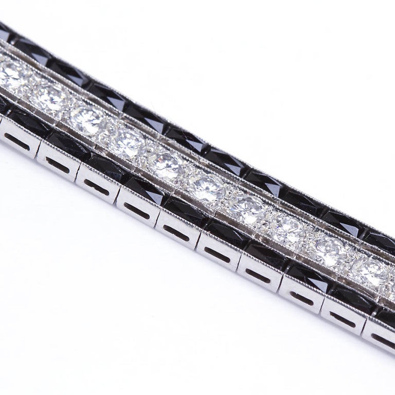 French Cut 5.25 Carat Art Deco Diamond and Onyx Bracelet set in Platinum For Sale