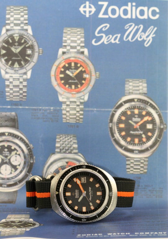 Zodiac stainless steel Super Sea Wolf dive wristwatch with date and orange minutes hand.