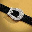Platinum and diamond Edwardian buckle on a new black leather belt.