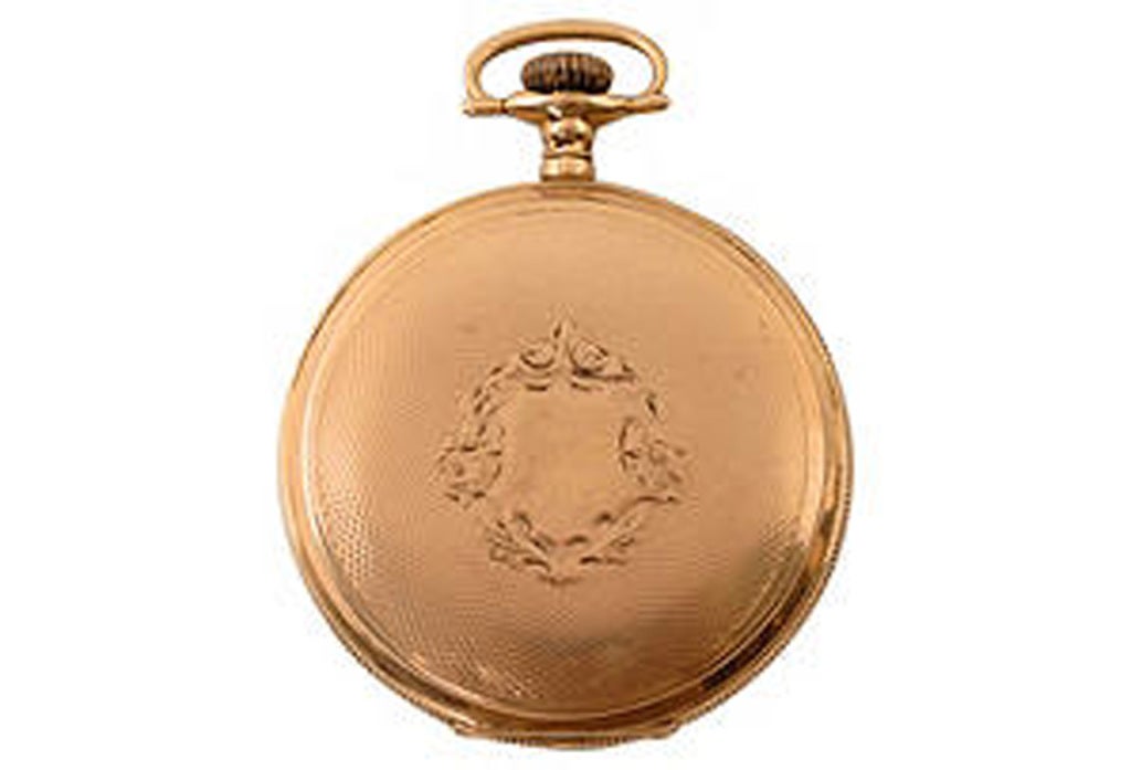 This beautiful 14k pocket watch is made by Waltham. It has a triple case, numbered 583785, that has intricate engravings and details. This watch was made around 1910. The dial has Arabic numbers and a subsidiary seconds hand. The movement are signed