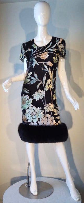 A fine vintage Pauline Trigere cocktail dress. Exquisite cut silk velvet item features a full black fox fur hemline. Item fully lined and zips up back. Matching scarf intact and included.