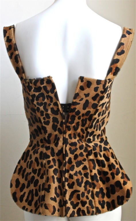 Very rare leopard printed pony fur bustier with built in bra from Azzedine Alaia dating to 1991. Fits a US size 0 or 2 (32