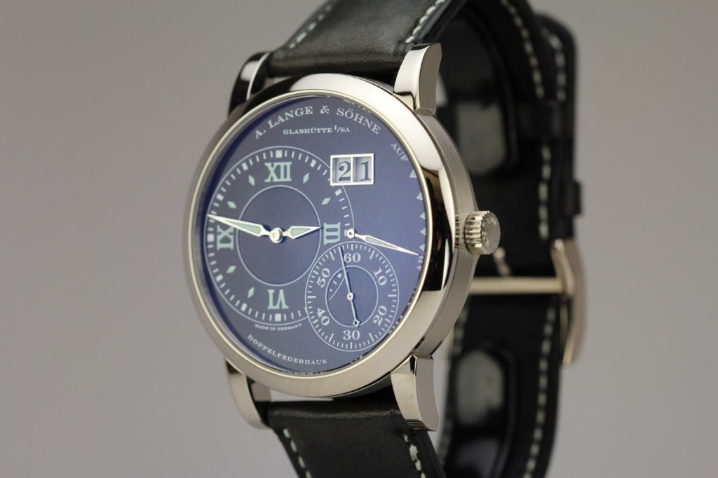 A Lange & Sohne 18k white gold Grand Lange 1 wristwatch, Ref. 115.029.
This is a rare Grand Lange 1 with a black luminous dial that features a big date and 72-hour power reserve.

This watch is in 18k white gold with a large 41.9mm case. It has a