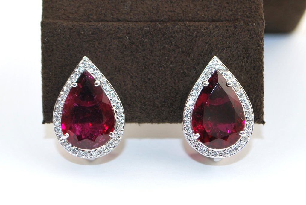 These elegant White Gold 13 ct Pear Shape Rubellite Earrings have Pave Diamonds weighing 5/8 cts .  Earrings measure 18mm in length and 13mm in width.