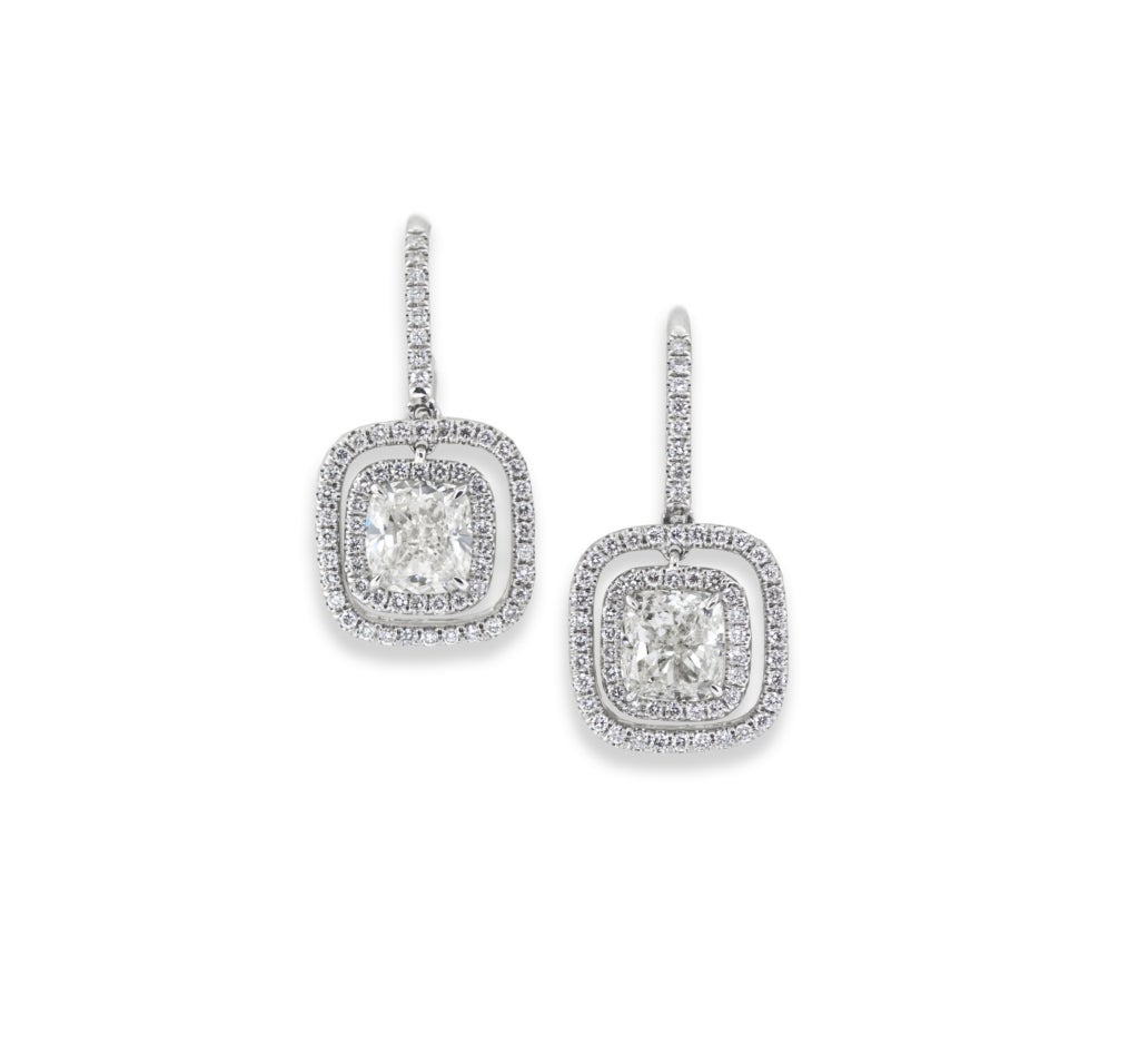 Platinum dangle style earrings with a 2.02 and 2.01 carat cushion cut diamonds of F and G color, VS and SI clarity, EGL. The cushion cut diamonds of antique cut and well matched.  Finding antique cushion cut diamonds is very difficult, as most of