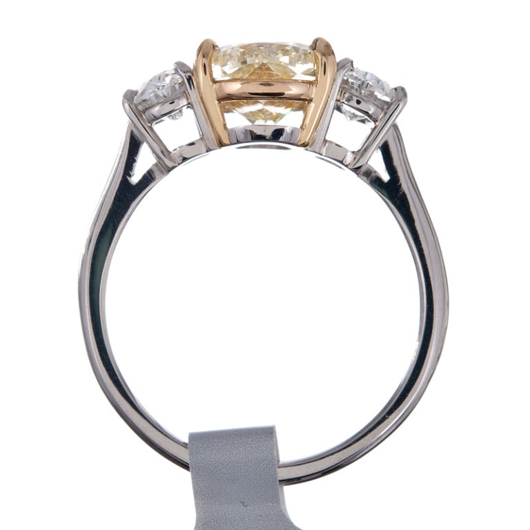 2.54Ct Fancy Yellow Diamond and White Diamond Three Stone Ring 1