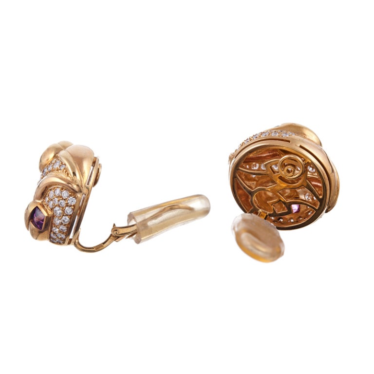 Exceptional pair of Bulgari earrings fashioned as robust button style clip ons. These designer earrings are unique clip ons made in typical 