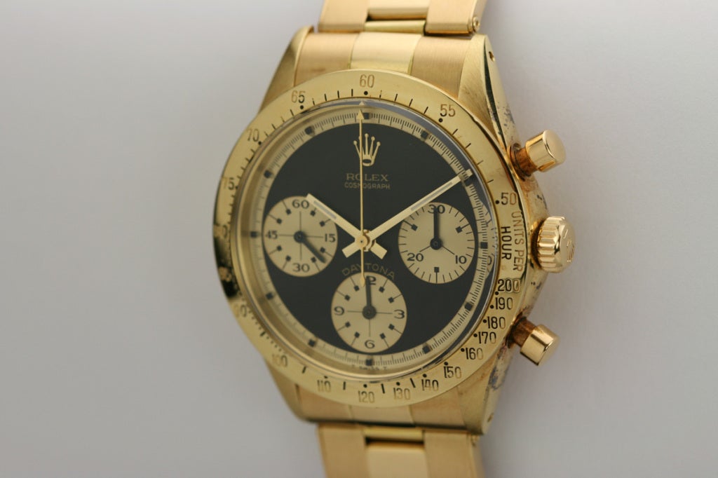 This is an exceptional example of the Rolex Daytona Paul Newman, Ref. 6239, in 18k gold with the most desired black original dial. The  original dial is in mint condition with no flaws. The case is in excellent condition with very little polish.