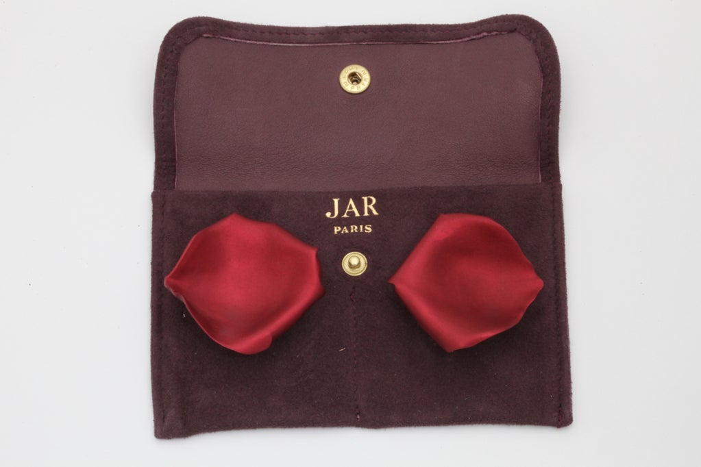 Exclusive piece of art by JAR (Joel Arthur Rosenthal). Each earring designed as a sculpted aluminum rose petal, mounted in 18k gold, with maker's marks Signed JAR. 

The earrings come with the original suede pouch.

JAR is often named the