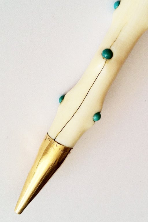 A fine and rare Jean Schlumberger mechanical pencil. Previously, the personal property of Mr. William de Lillo (assistant to Jean Schlumberger 1950s-1960s). Hand carved ivory pencil set with turquoise cabochons and gold mounts. Signed for Tiffany &