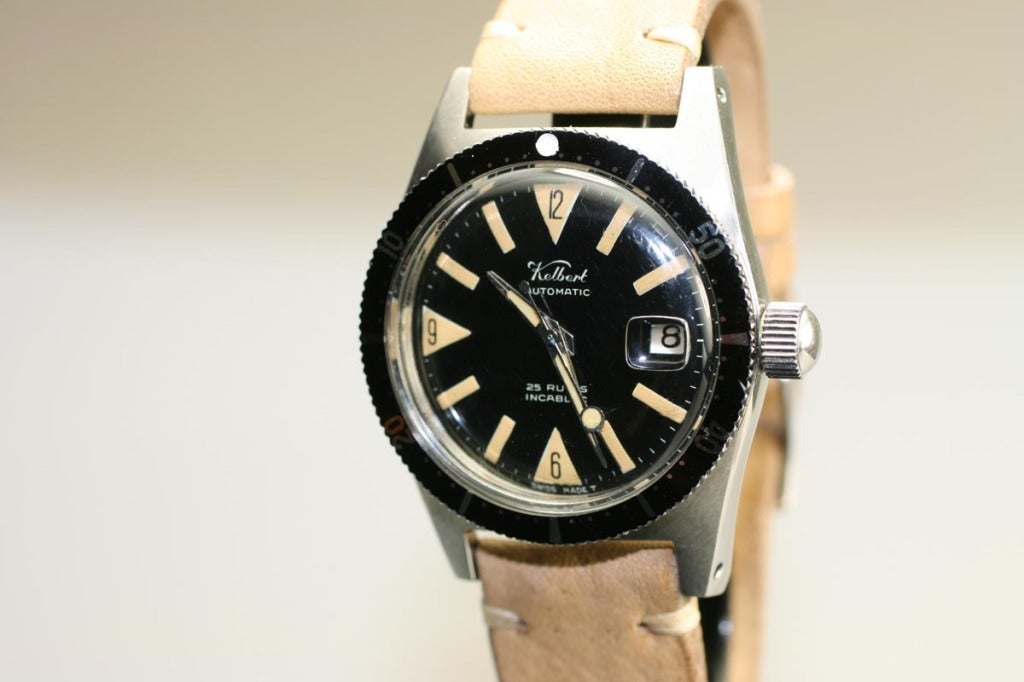 This is a rare stainless steel Kelbert dive watch in excellent condition with a black dial, aluminum bezel, screw down crown and case. In the 1950’s and 1960’s the Kelbert Watch Co was known for their complication movements.