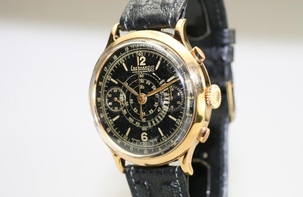 This is a vintage Eberhard & Co. chronograph from the 1930s with a 39mm gold-plated case, original black dial with spiral tachymeter scale, and a manual wind movement.