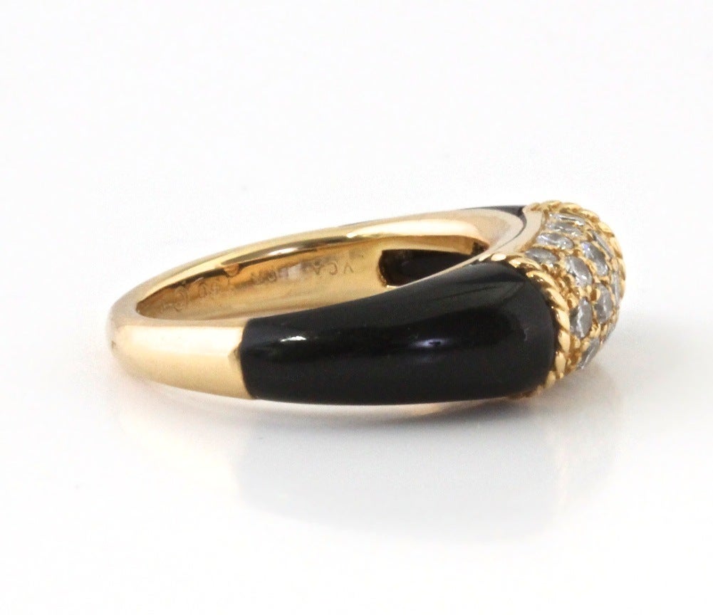 This is a sophisticated, classic ring. The ring is stamped VCA and it's numbered. A solid addition to any collection.

WEIGHT: 6.9 Grams

METAL: 18k Yellow Gold

STONE: Onyx

NUMBER OF DIAMONDS: 17

WEIGHT: .5 Carats (approx)

SIZE: 5.5