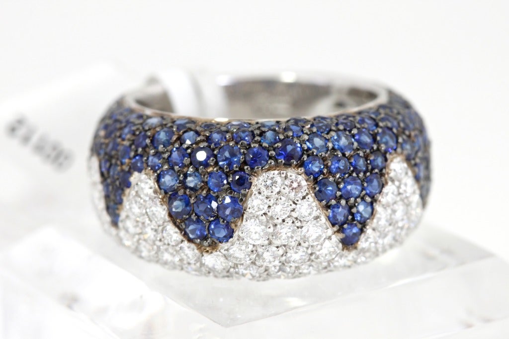 Contemporary CHOPARD Blue Sapphire Diamond Wave Ring For Sale