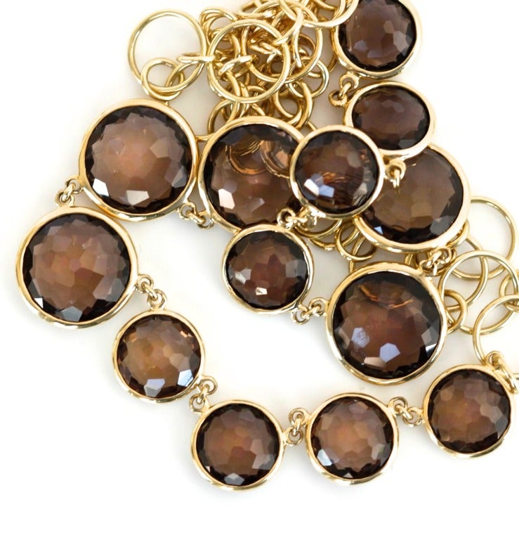 Visit MatterLA.com for more jewelry and accessories.

This necklace is made up of varying sizes of round, faceted circle smoky quartz stones set into yellow gold. This line is so pretty and versatile and playful. This is a brand new necklace with