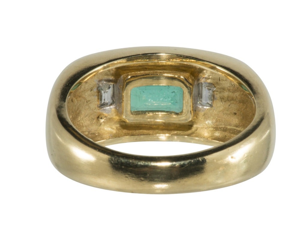 18k yellow gold approximately 3 carat emerald cut emerald and .96 pts emrald cut diamonds Ring
