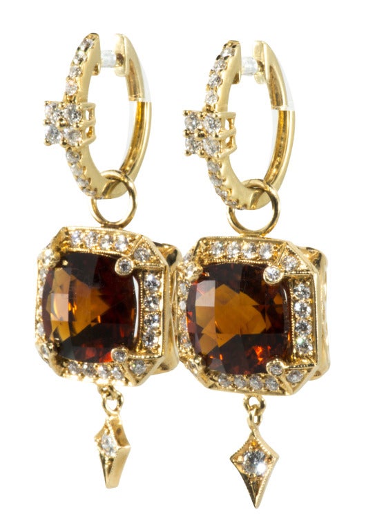 18k gold and diamond huggies $720 18 karat gold and Diamond and Garnet earrings $12,600 sold separately or together