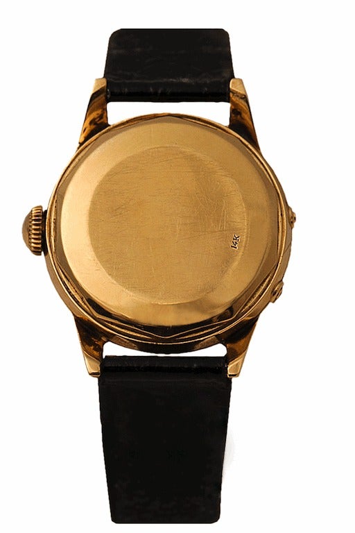 Movado yellow gold Calendomatic wristwatch in 14k yellow gold. The watch features an automatic bumper movement.