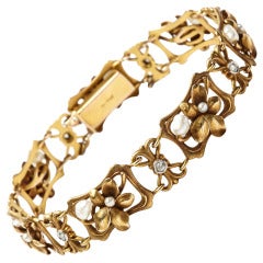 A yellow golden floral, diamond and pearl Art Nouveau bracelet