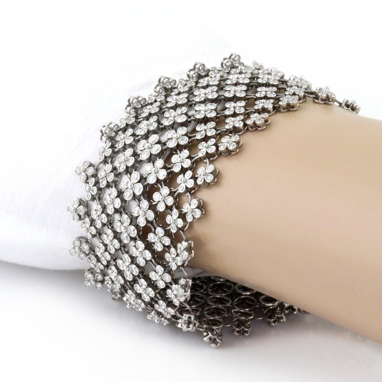 Visit MatterLA.com for more jewelry and accessories.

The bracelet has round  diamonds  weighing  approximately  11.50  carats,  length  6.50 (16.5cm) inches, width is 1.5 inches (4cm), and signed  Tiffany. Total weight is 72.7 grams. This