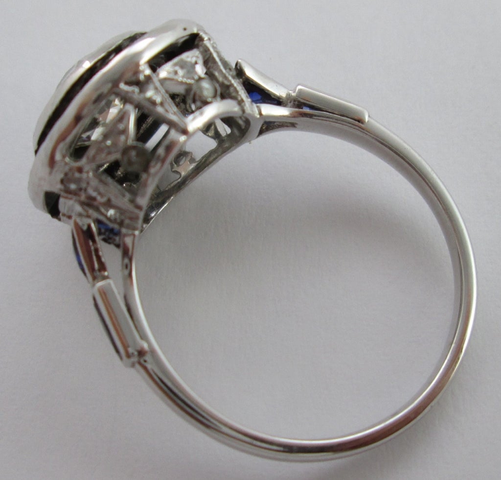Women's An early 20th Century Platinum, Diamond and Sapphire cluster Ring