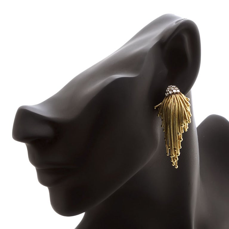 A pair of flamboyant gold tassel earrings of rope twist design in 18k & plat with diamond accents. Also known as mop-head or shaggy. We have a matching brooch (dealer ref 2813).

Dealer ref. 2814